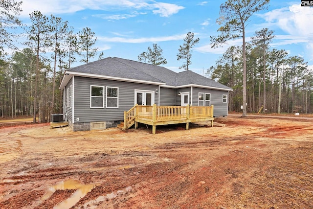 back of house with a wooden deck and central air condition unit