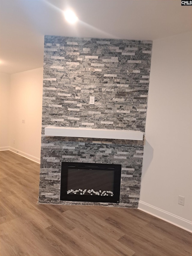 interior details with a fireplace and hardwood / wood-style floors