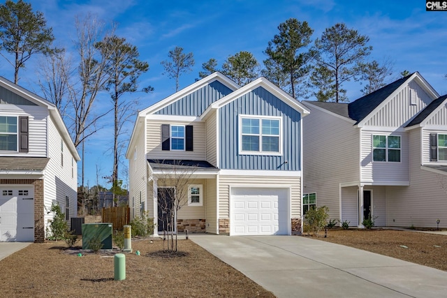 view of front of property with a garage and central air condition unit