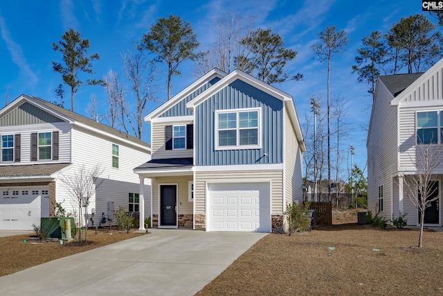 view of front of property featuring a garage and central air condition unit