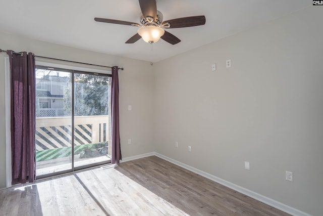 unfurnished room with ceiling fan and wood-type flooring