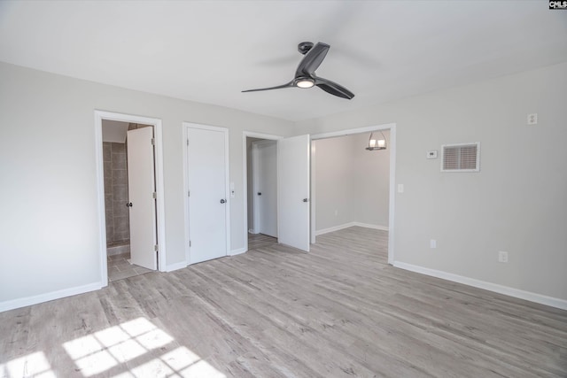 unfurnished bedroom with ceiling fan, light hardwood / wood-style floors, ensuite bathroom, and a closet