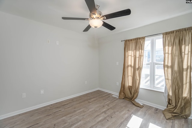 unfurnished room with ceiling fan and light wood-type flooring