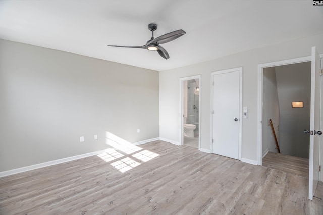 unfurnished bedroom with ceiling fan, light hardwood / wood-style flooring, and ensuite bath