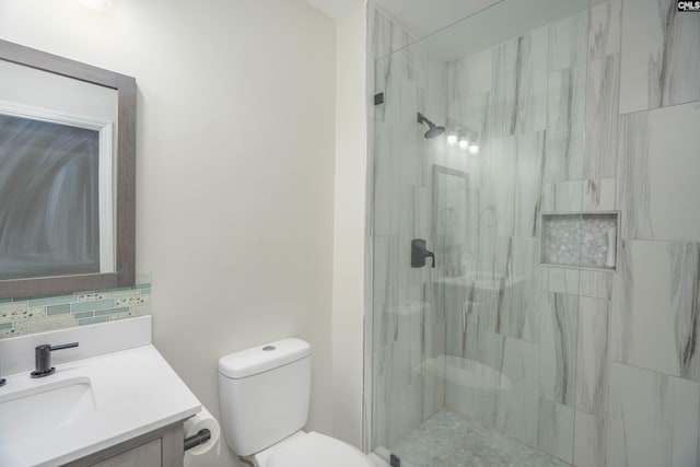 bathroom with toilet, a shower, backsplash, and vanity