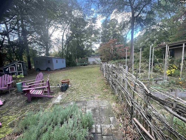 view of yard with a storage unit