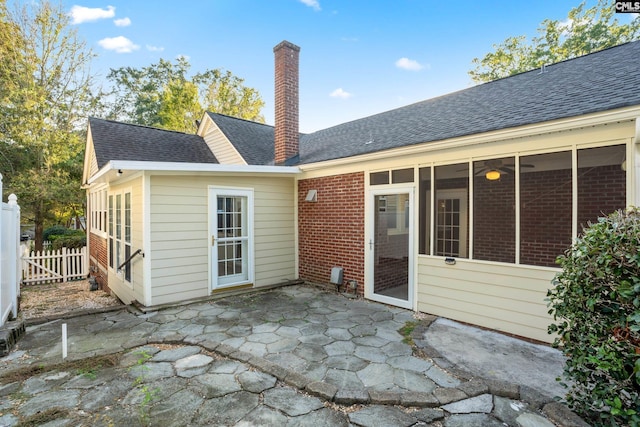 back of property featuring a patio area and a sunroom