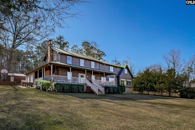 view of front of house featuring a front yard and covered porch