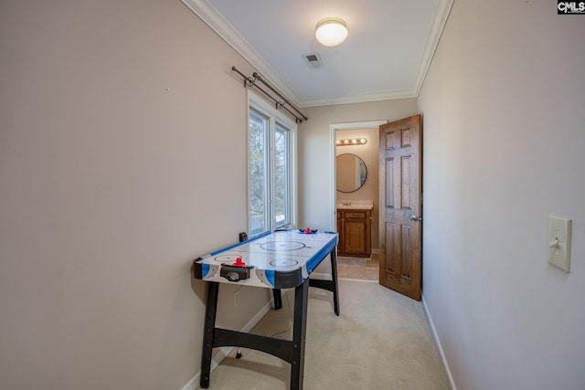 playroom with light carpet and ornamental molding