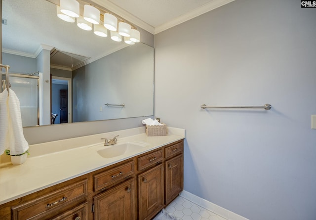 bathroom with tile patterned flooring, crown molding, and vanity