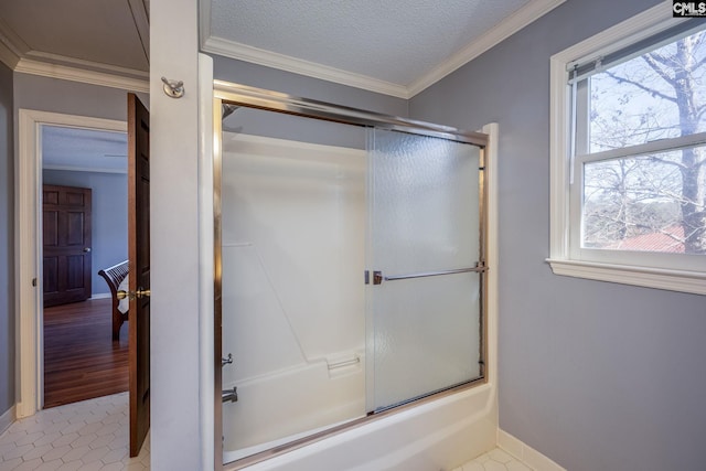 bathroom featuring a wealth of natural light, tile patterned flooring, crown molding, and enclosed tub / shower combo