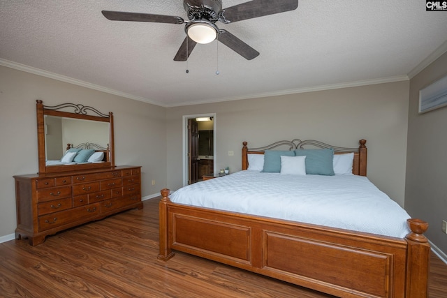 bedroom featuring ceiling fan, a textured ceiling, ornamental molding, and hardwood / wood-style floors