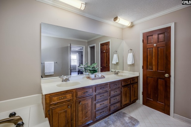 bathroom with vanity, a textured ceiling, and ornamental molding