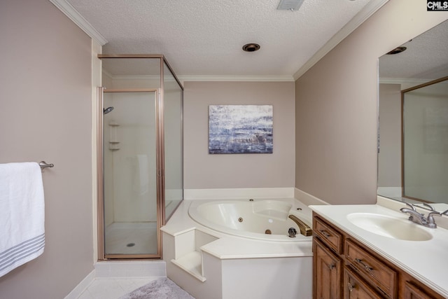 bathroom featuring a textured ceiling, plus walk in shower, vanity, and tile patterned flooring