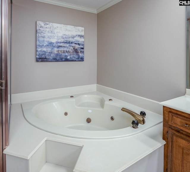 bathroom with a tub to relax in, vanity, and crown molding