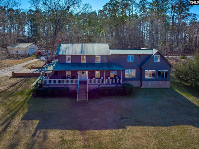 back of house with a yard and a porch