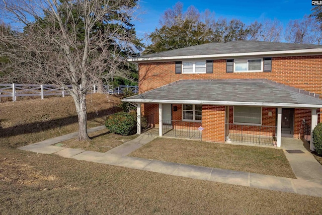 view of front of home with a front lawn