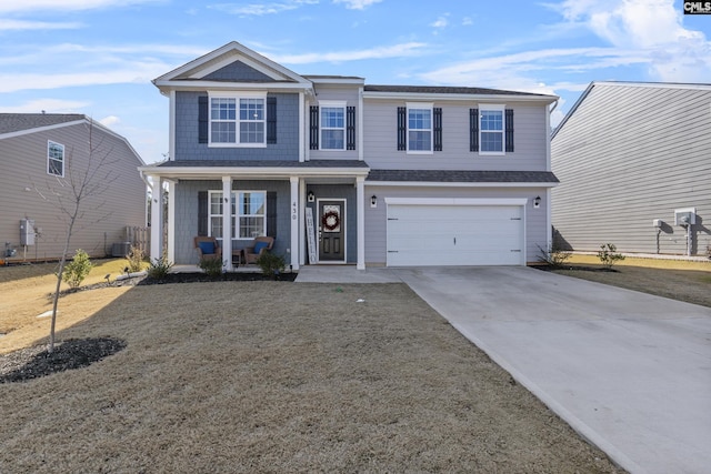 view of front of home featuring covered porch, a garage, and central AC