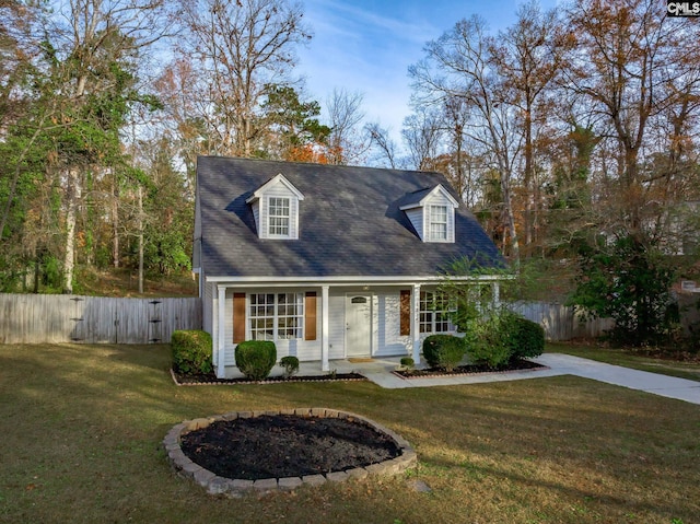 cape cod-style house with a front lawn and a porch