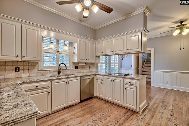 kitchen featuring dishwasher, sink, white cabinets, and kitchen peninsula