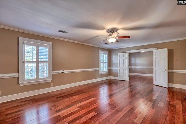 unfurnished bedroom featuring hardwood / wood-style floors and multiple windows