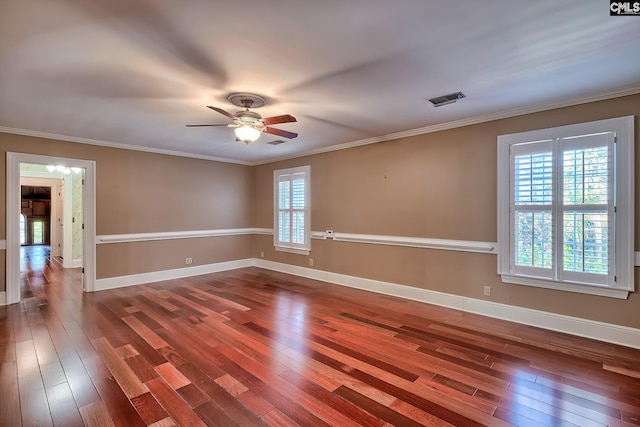 empty room with crown molding, wood-type flooring, and ceiling fan