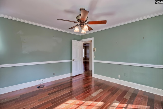 empty room featuring crown molding, hardwood / wood-style flooring, and ceiling fan