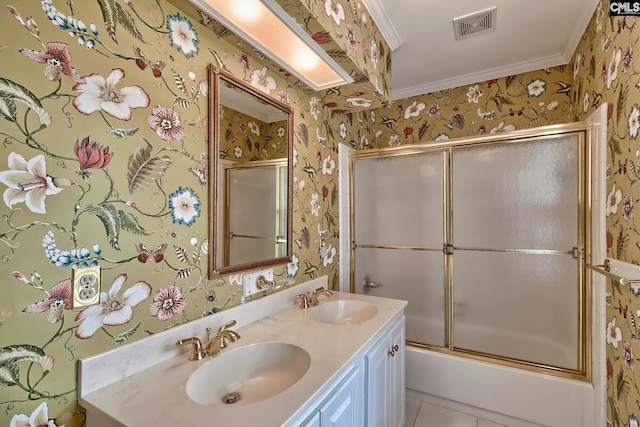 bathroom with tile patterned flooring, ornamental molding, vanity, and shower / bath combination with glass door