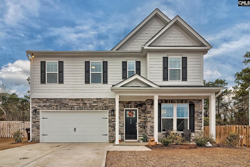 craftsman-style home with a garage