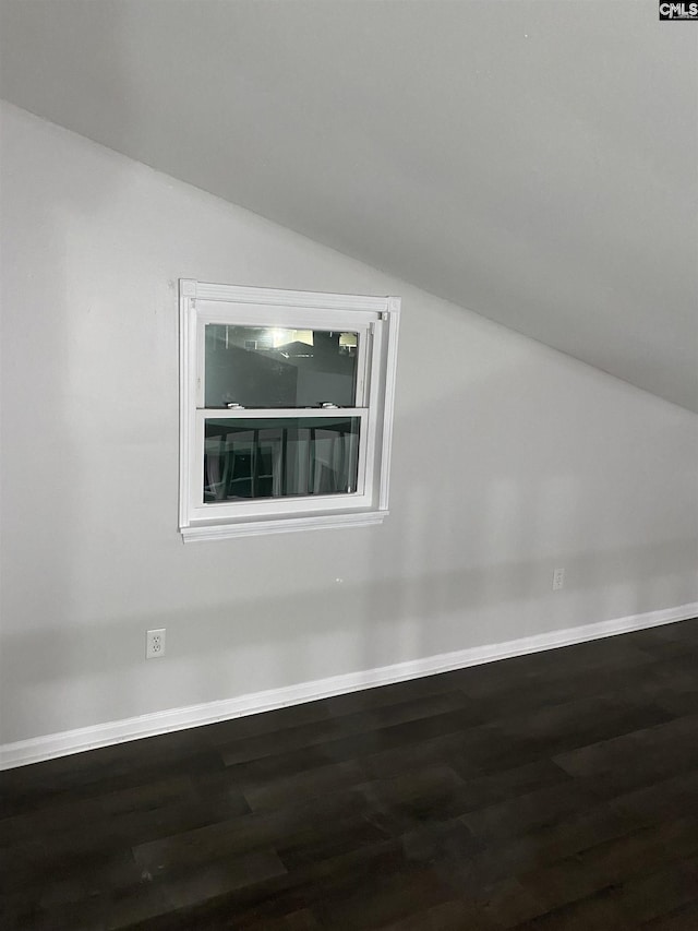 bonus room with hardwood / wood-style flooring and lofted ceiling