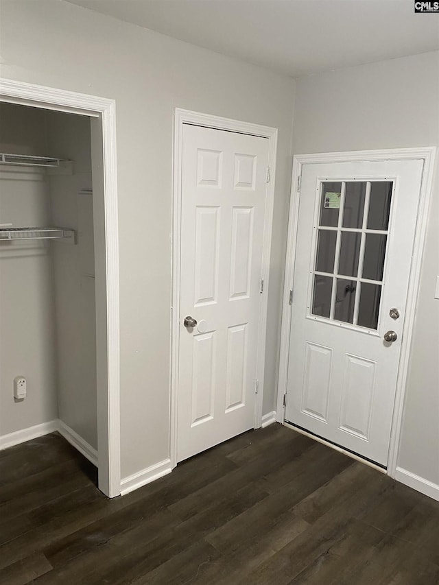 interior space with dark hardwood / wood-style flooring