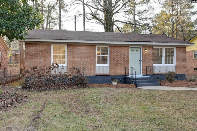 ranch-style home with a front yard