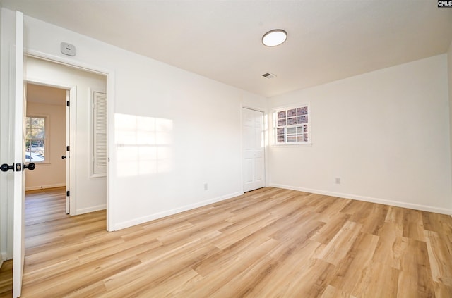 unfurnished room with light hardwood / wood-style floors