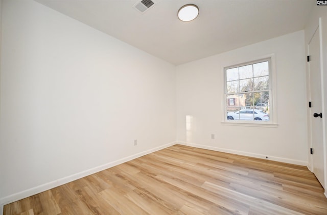 spare room with light wood-type flooring