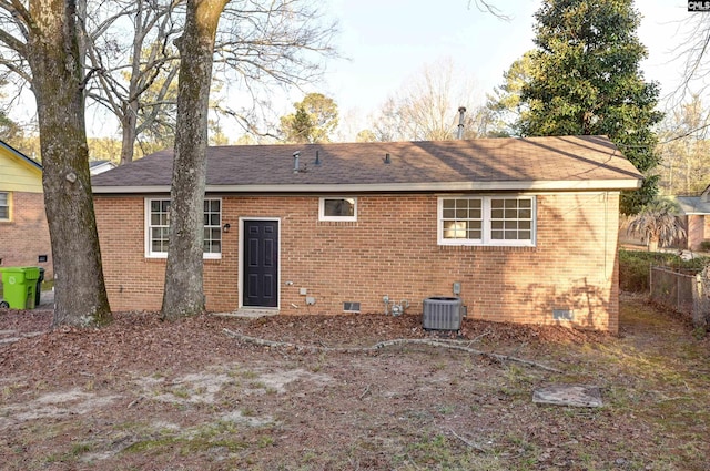 rear view of property featuring central AC unit