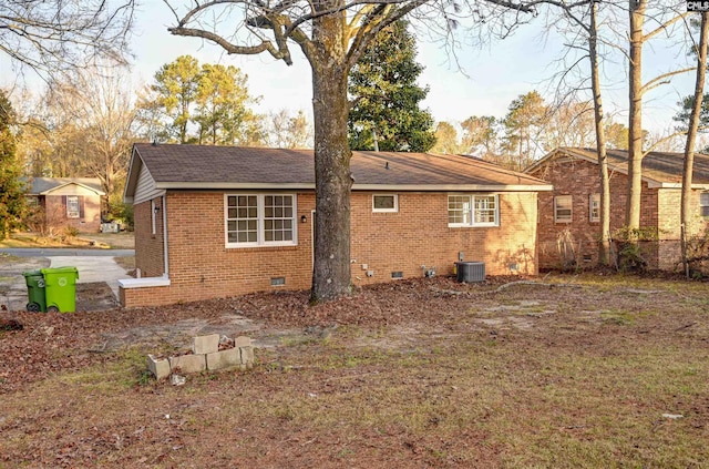 rear view of house featuring cooling unit