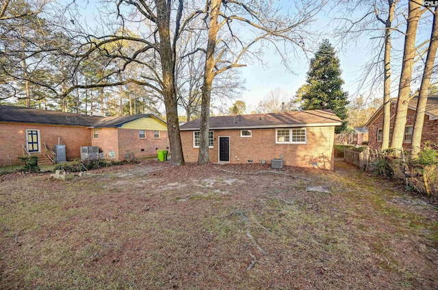 rear view of property with central air condition unit