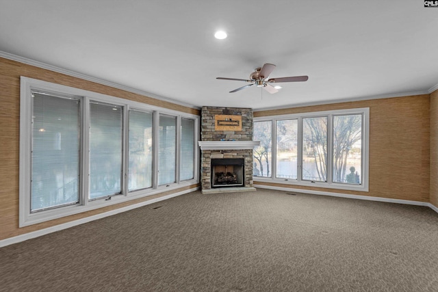 unfurnished living room featuring ceiling fan, a fireplace, and carpet flooring