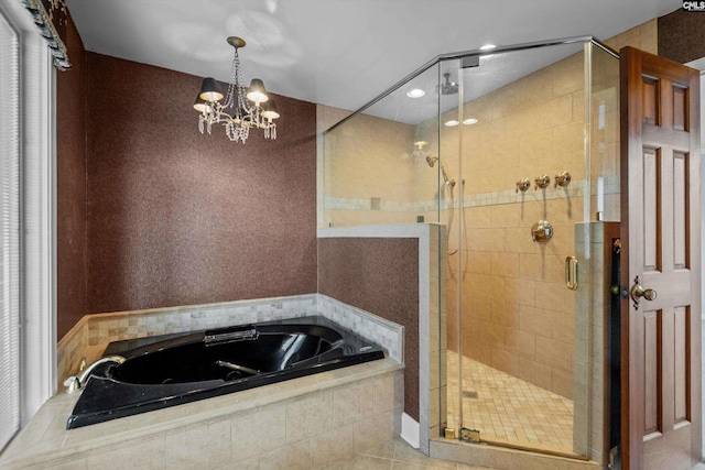 bathroom with plus walk in shower, a chandelier, and tile patterned floors