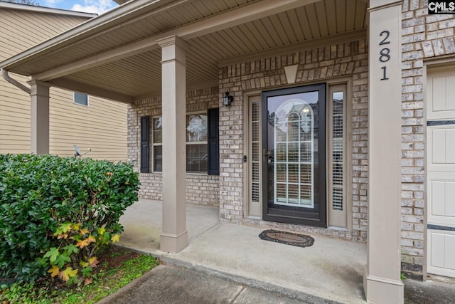 property entrance featuring covered porch