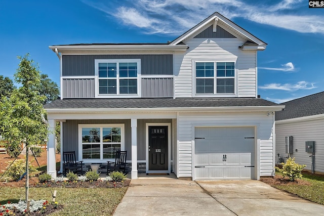 view of front of home with covered porch and a garage