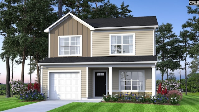 view of front facade with a garage and a yard