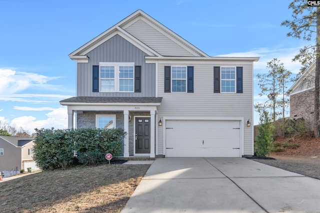 traditional home featuring driveway, an attached garage, and board and batten siding