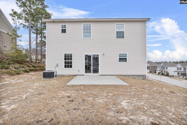 rear view of property featuring a patio area