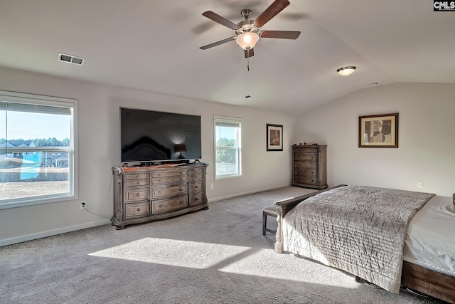 bedroom with vaulted ceiling, ceiling fan, and light colored carpet