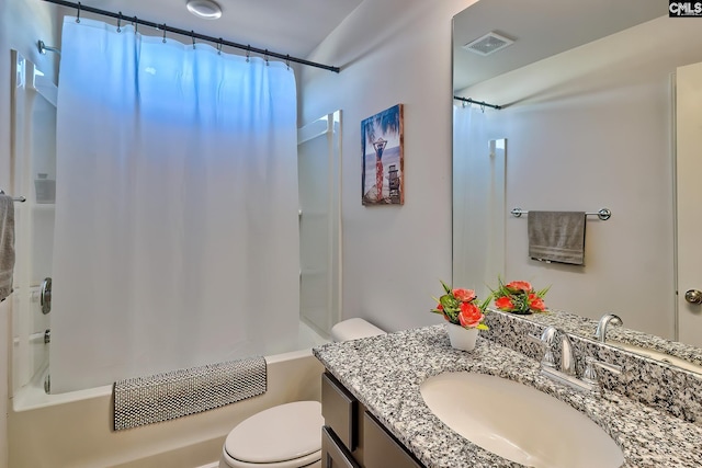 full bathroom with toilet, vanity, and shower / bath combo with shower curtain