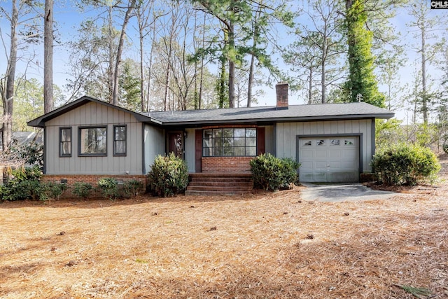 single story home featuring a garage