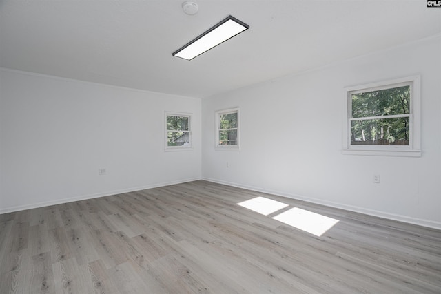 unfurnished room with light hardwood / wood-style floors