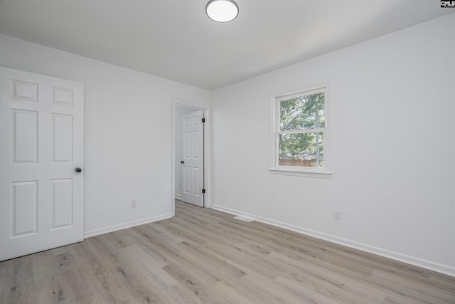 unfurnished room featuring light hardwood / wood-style flooring