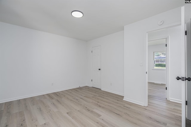 spare room with light hardwood / wood-style flooring